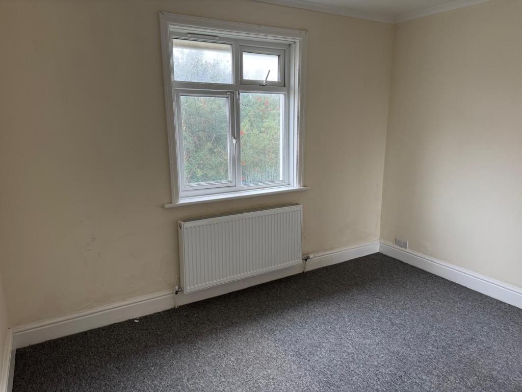 Lot: 143 - FIRST FLOOR FLAT FOR INVESTMENT - main bedroom with carpet and magnolia wall